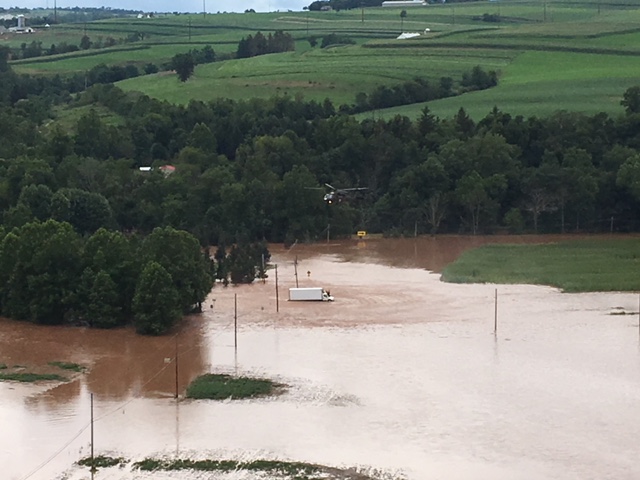 The Pennsylvania Helicopter Aquatic Rescue Team based at Fort Indiantown Gap conducted a hoist rescue of nine civilians, including six adults, three children and their three pets stranded on a roof in Columbia County Aug. 13.