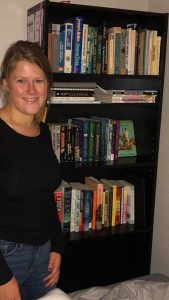 Earley is pictured with her growing library.