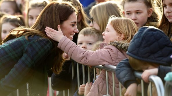 Britain's Catherine, Duchess of Cambridge reacts as a young girl touches her hair whilst she greets well-wishers outside of a community center in Dundee, eastern Scotland, on Jan. 29, 2019.