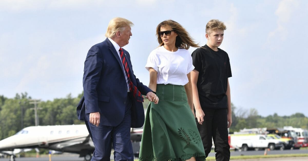 US-POLITICS-TRUMP US President Donald Trump, First Lady Melania Trump and son Barron Trump board Air Force One in Morristown, New Jersey, on August 18, 2019. (Photo by Nicholas Kamm / AFP) (Photo credit should read NICHOLAS KAMM/AFP/Getty Images)