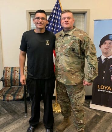 Luis Enrique Pinto Jr. with his recruiter, Staff Sgt. Philip Long.